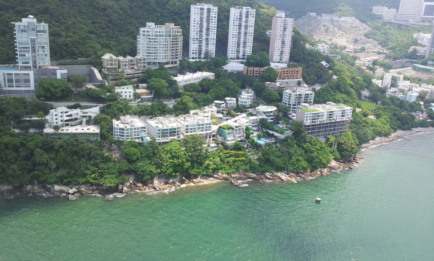 Villa Cecil on Victoria Road, seen from the water with Pok Fu Lam behind
