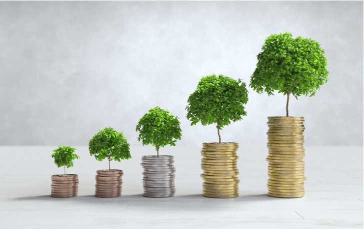 Five stacks of coins of increasing height, each with a small tree growing from the top